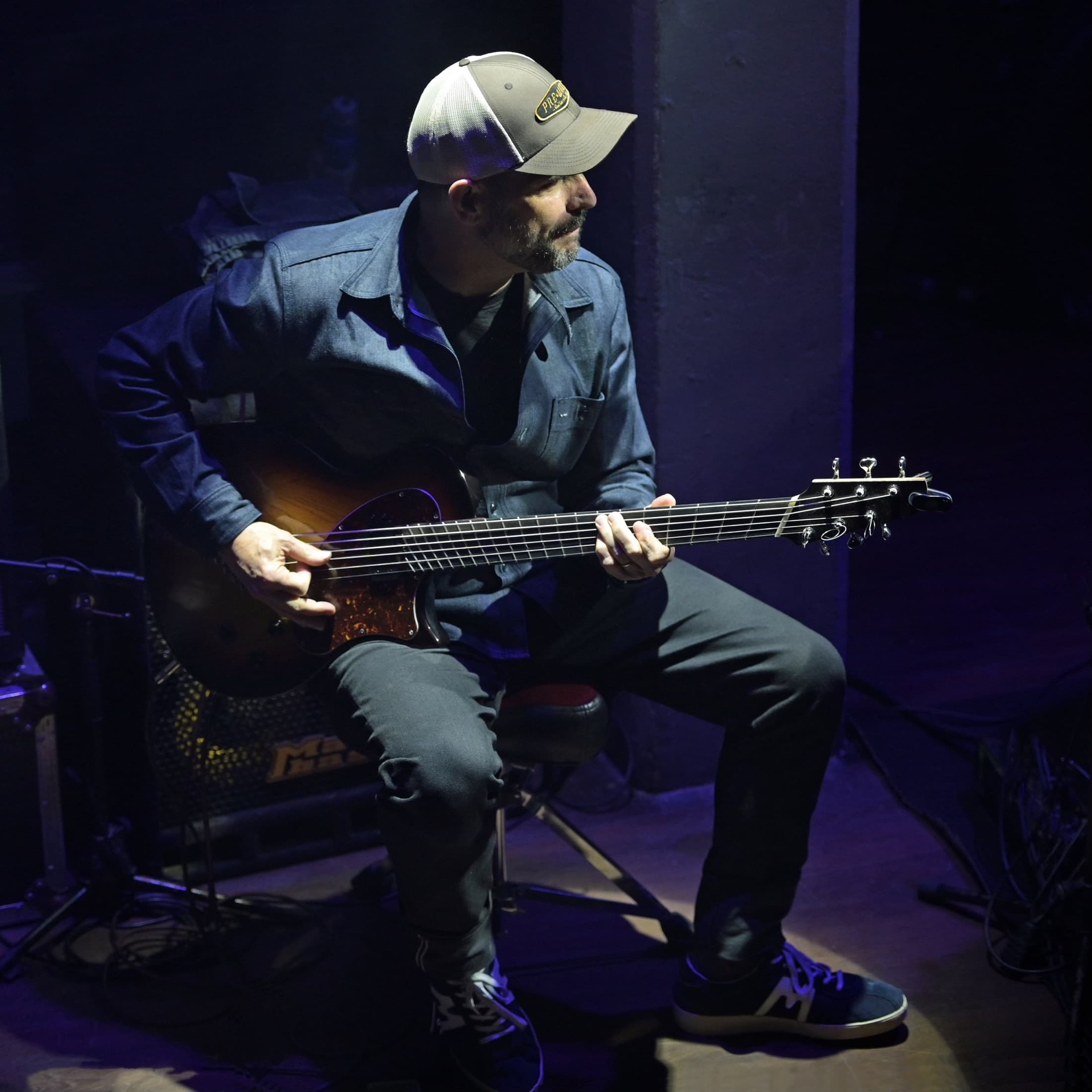 Charlie Hunter seated with a seven-string guitar